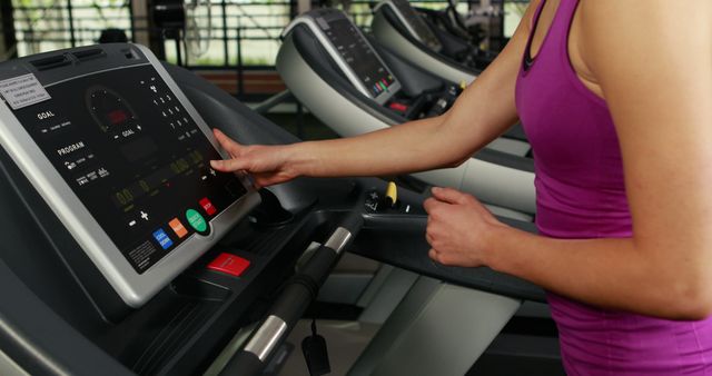 Close-up Woman Using Treadmill Touch Screen at Gym - Download Free Stock Images Pikwizard.com