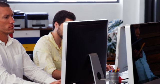 Focused Professionals Working at Office Desks on Desktop Computers - Download Free Stock Images Pikwizard.com