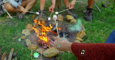 Roasting marshmallows over campfire with ar hud overlay, friends gathering around fire