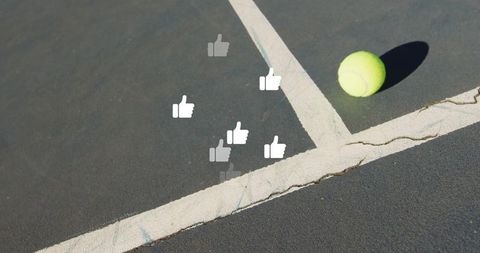 Tennis Ball on Court with Digital Thumbs-Up Icons in Movement