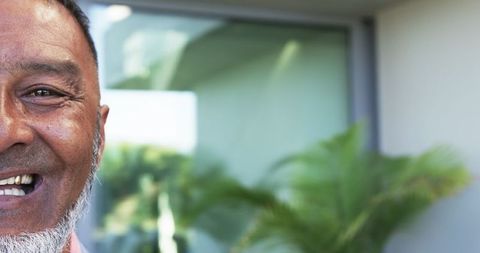 Joyful Mature Man Smiling with Outdoor Copy Space Background