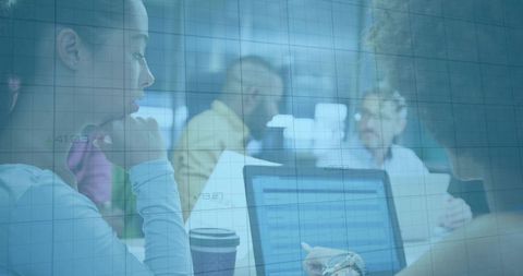 Coworkers Collaborating in Modern Office Meeting