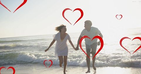 Diverse Couple Holding Hands and Running on Beach with Love Theme