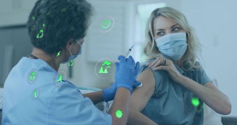 Healthcare Professional Administering Vaccine with Technology Icons