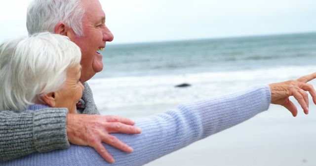 Happy Senior Couple Enjoying Beach Before Ocean - Download Free Stock Images Pikwizard.com