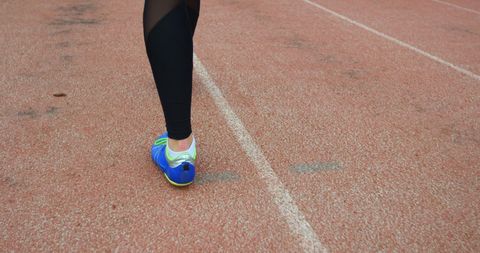 Female Athlete in Compression Wear Walking on Track - Download Free Stock Images Pikwizard.com