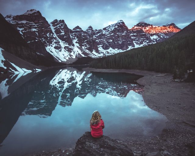 Woman Enjoying Serene Mountain Lake at Twilight - Download Free Stock Images Pikwizard.com