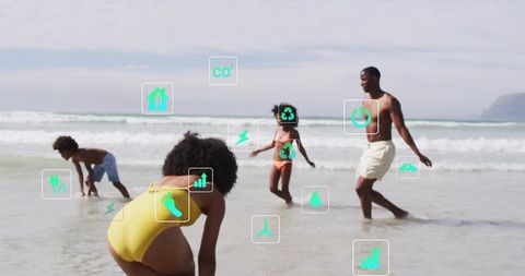 Family enjoying beach with eco icons overlay promoting sustainability and clean energy
