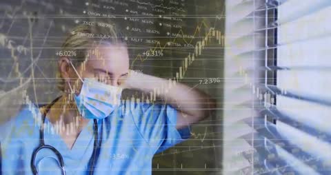 Exhausted Nurse in Scrubs Analyzing Complex Data in Hospital Setting