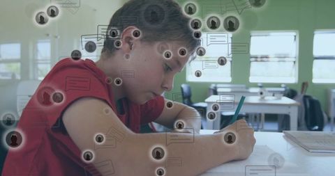 Focused schoolboy writing at desk with chat bubble overlay illustrating digital distraction