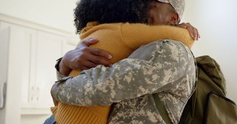 Joyful Reunion of Soldier and Spouse in Warm Embrace - Download Free Stock Images Pikwizard.com