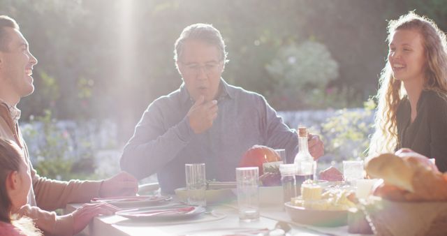 Happy Family Enjoying Outdoor Meal Together in Garden - Download Free Stock Images Pikwizard.com