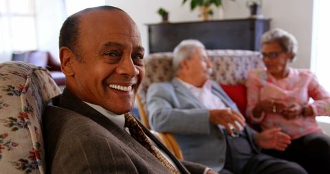 Smiling Senior Man in Suit at Nursing Home Gathering - Download Free Stock Images Pikwizard.com