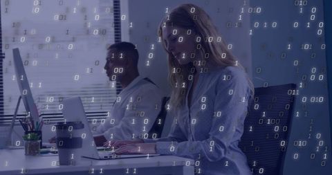Binary Code Overlays Professionals in Modern Office