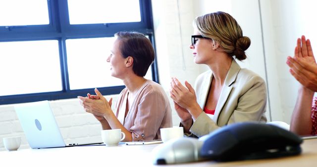 Businesswomen Applauding During Meeting in Modern Office - Download Free Stock Images Pikwizard.com