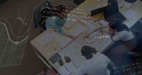 Diverse Team Analyzing Business Plan with Stock Market Overlay