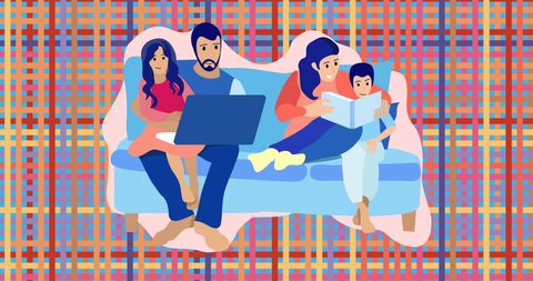Happy Family Relaxing on Couch with Laptop and Book