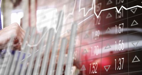 Executive interacting with translucent financial dashboard showing stock charts and data