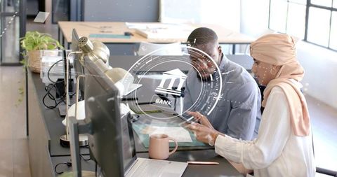 Diverse fintech team collaborating with digital technology overlay