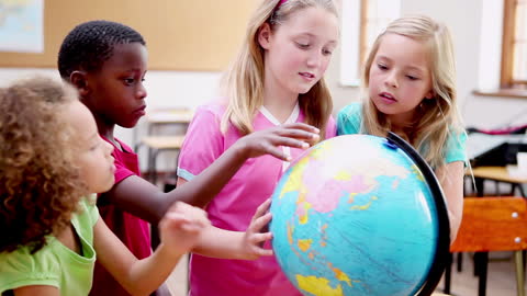 Curious Multiracial Kids Exploring World Globe Together