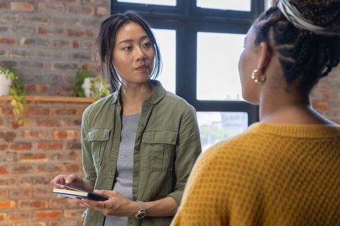 Diverse Coworkers Collaborating in Modern Loft Office