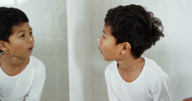 Curious Boy Observing Reflection in Mirror - Download Free Stock Images Pikwizard.com