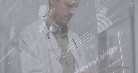 Mature doctor reviewing digital diagnostics on tablet with ecg and analytics overlays