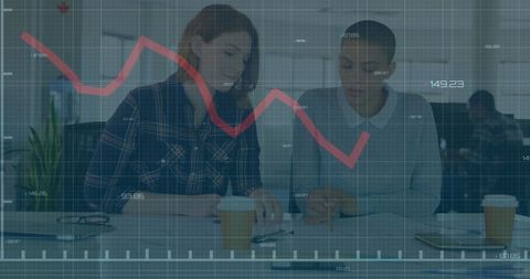 Businesswomen strategizing amid declining stock market trends