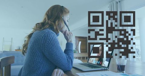Woman in sweater engages in video call with qr code overlay