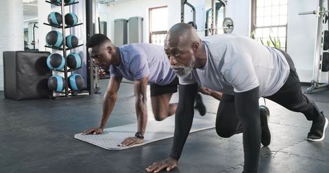 African American Men Performing Mountain Climbers for Vitality