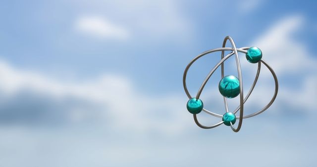 Spinning Atom Models Against Blue Sky with Clouds - Download Free Stock Images Pikwizard.com