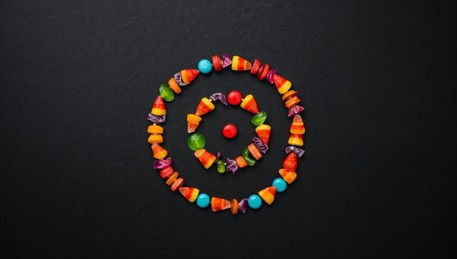 Colorful candy spirals on black background