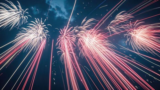 Vibrant Fireworks Burst Illuminating Night Sky