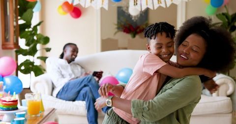 Joyful Birthday Embrace with Family at Home Celebration