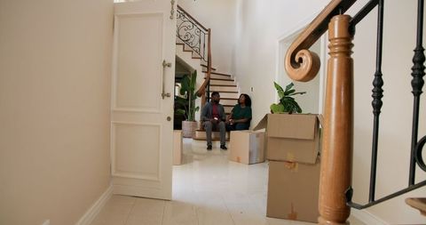 Couple Relocating to New Home, Happy Moments on Stairway Landing