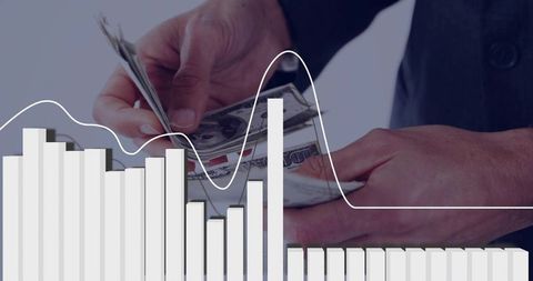 Businessman counting cash with financial chart and bar graph overlay showing revenue trends