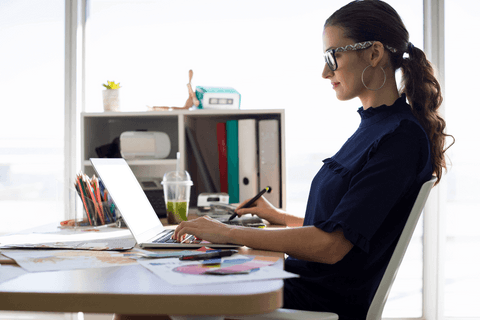 Transparent female executive working with laptop in modern office - Download Free Stock Videos Pikwizard.com