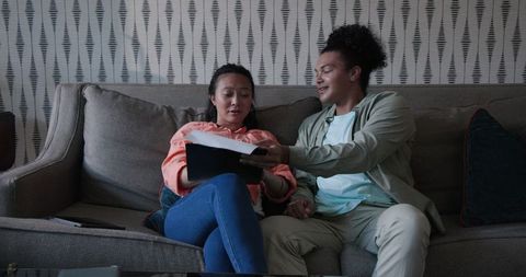 Couple relaxing on sofa enjoying quality time