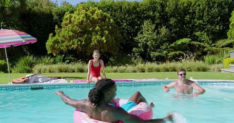 Friends Enjoying Summer at Backyard Pool Party