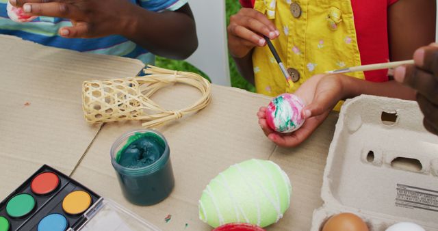 Image of hands of diverse grandmother and grandson painting easter eggs in garden - Download Free Stock Photos Pikwizard.com