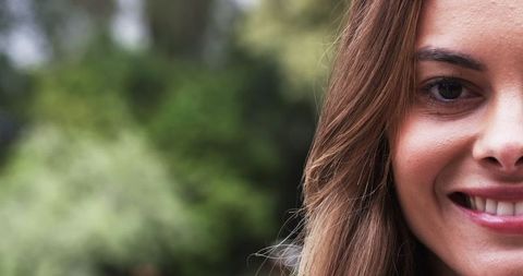 Close-Up of Happy Woman Amidst Nature's Lush Environs