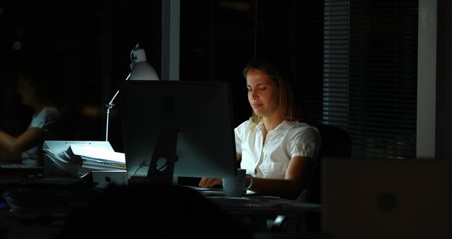 Businesswoman Working Late on Computer in Office - Download Free Stock Photos Pikwizard.com