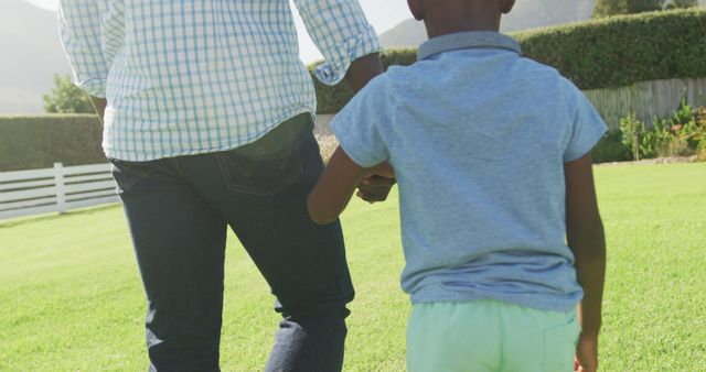 Parent and Child Holding Hands Outdoors - Download Free Stock Images Pikwizard.com