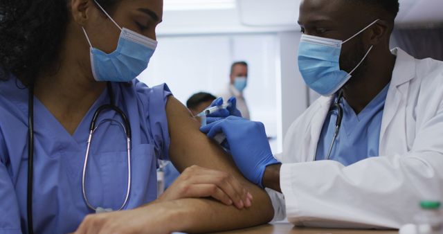 Healthcare Professionals Administering Vaccine in Clinic Setting - Download Free Stock Images Pikwizard.com