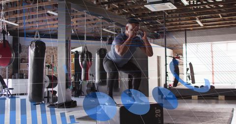 Man Squatting with Fitness Data Overlay in Industrial Gym