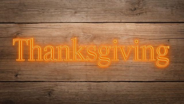 Glowing Neon Thanksgiving Sign Sitting on Rustic Wood Planks with Warm Orange Light