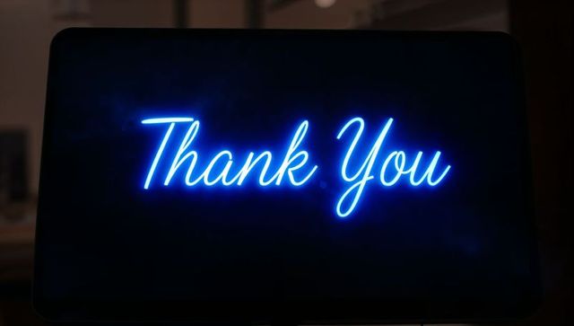 Neon Blue Cursive Thank You Sign Glowing on Dark Round Display for Greeting and Marketing