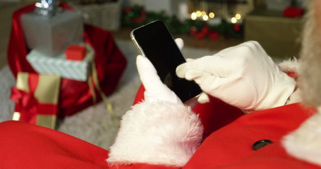 Santa Claus using smartphone during Christmas - Download Free Stock Images Pikwizard.com