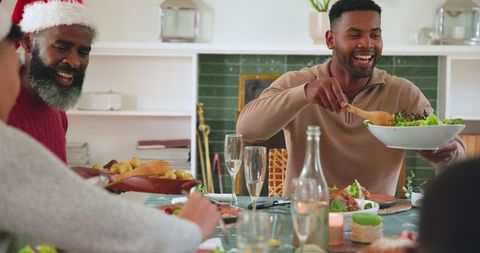 Family Enjoying Festive Meal Together at Holiday Celebration