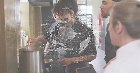 Culinary team stirring stockpot with holographic globe overlay during training